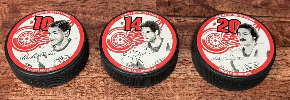 Lot 3 Vintage ‘96 -‘97 Red Wings Hockeytown Pucks: Delvecchio; Shanahan; Redmond